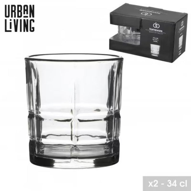 A clear cut-glass tumbler with a thick base and vertical fluted pattern, shown alongside its black Urban Living branded packaging box on a white background.