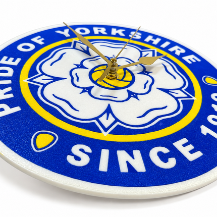 A round wall clock featuring the Yorkshire club crest with the text 'PRIDE OF YORKSHIRE' and 'SINCE 1919' in white on a blue background, with gold clock hands.