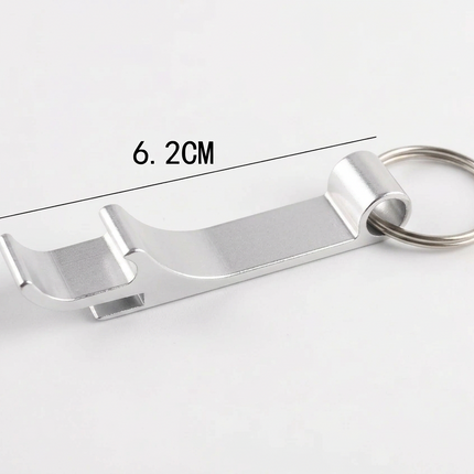 A silver metal bottle opener keychain with a key ring, shown on a white background with dimension lines indicating a length of 6.2CM and a height of 1.
