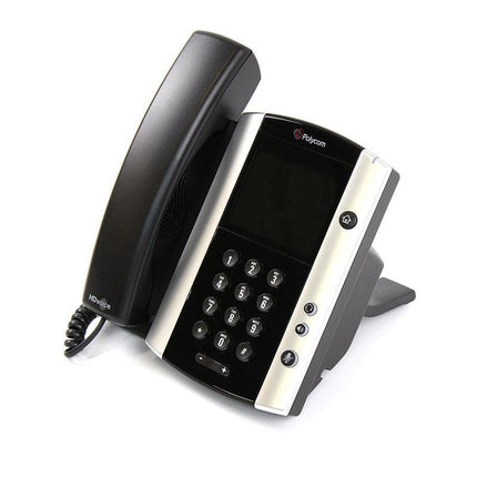 A Polycom landline phone with a black handset and a silver-and-black base, photographed on a clean white background.